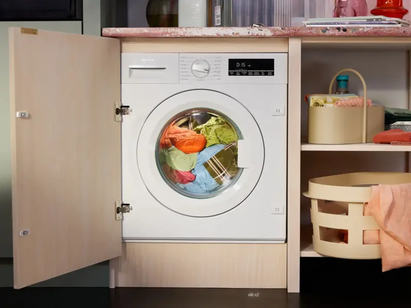 NEFF integrated washing machine in open kitchen cabinetry