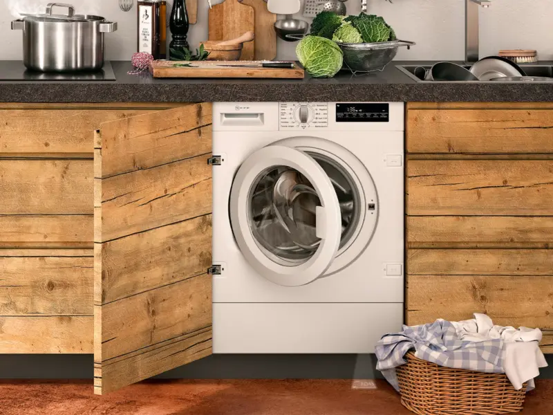 NEFF integrated washer dryer beneath a kitchen worktop